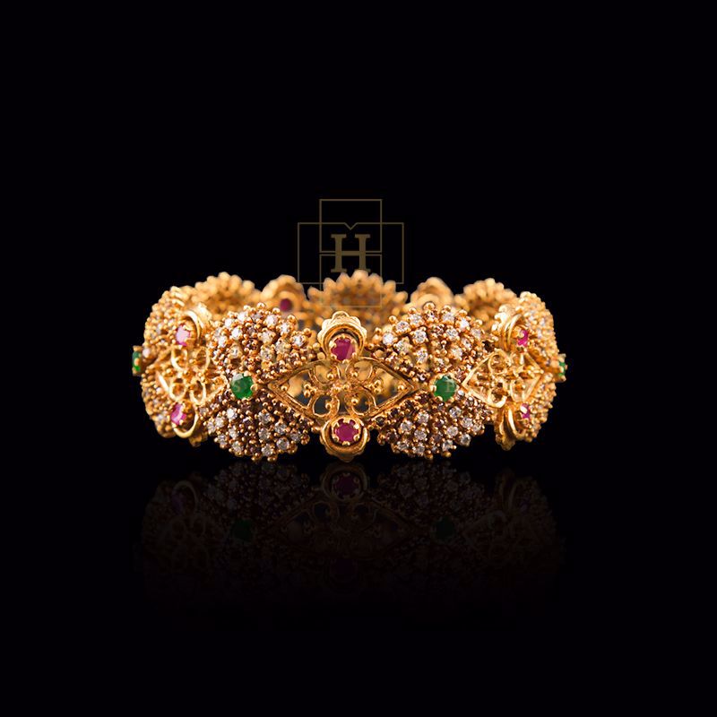 Emerald, rubies and zircon bangle (Each)