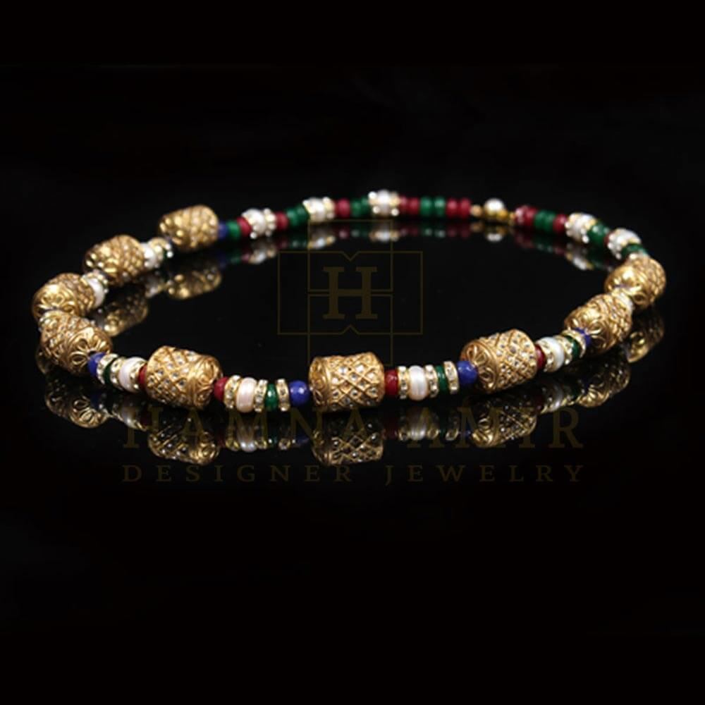 Gold chunks mala with ruby emeralds  pearls and sapphires