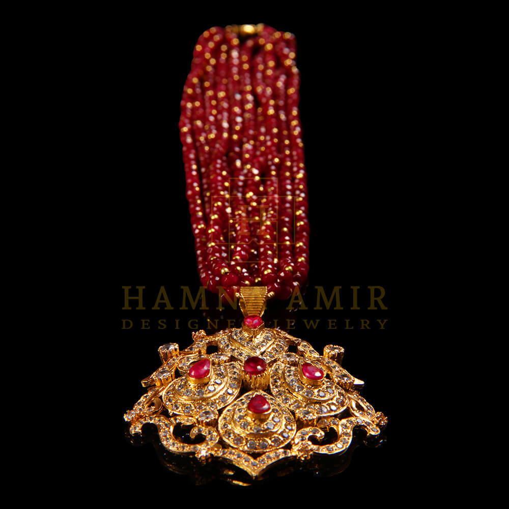 Gold plated ruby and zircon mala